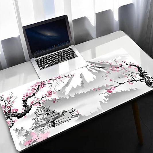 tapis de souris xxl sur table blanche avec pc portable